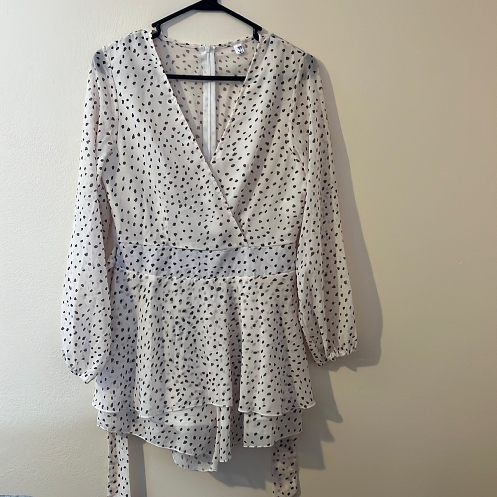 Polka Dot Long sleeve Romper with plunging neckline. Size small.